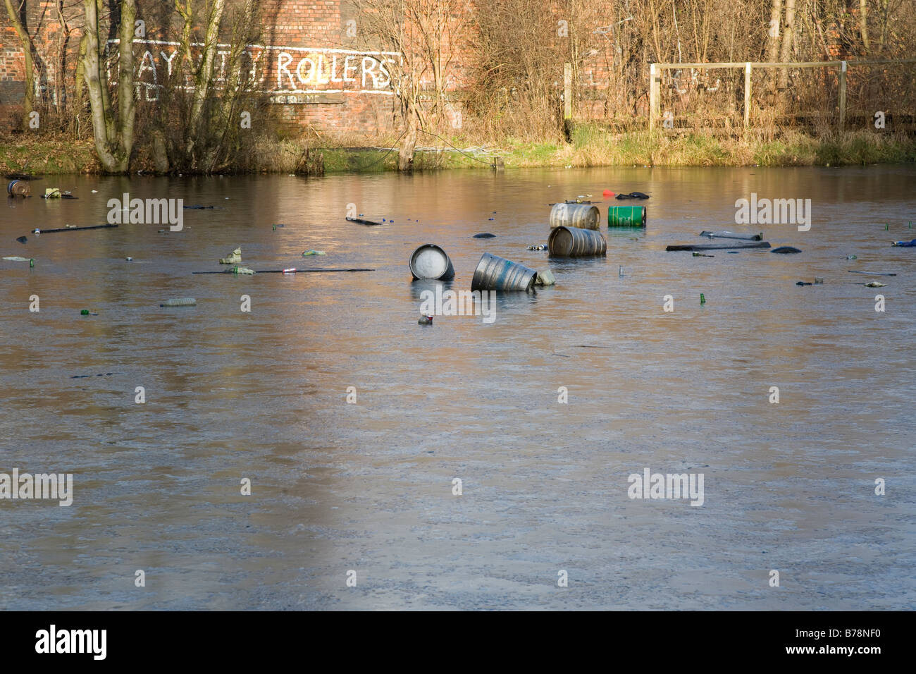 frozen lake with rubbish floating Stock Photo