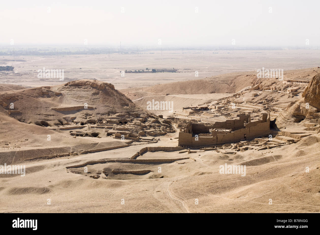 View over the Theban Hills on the West Bank of the Nile, looking towards Deir el Medina and Ptolemaic Temple, Luxor Egypt Stock Photo