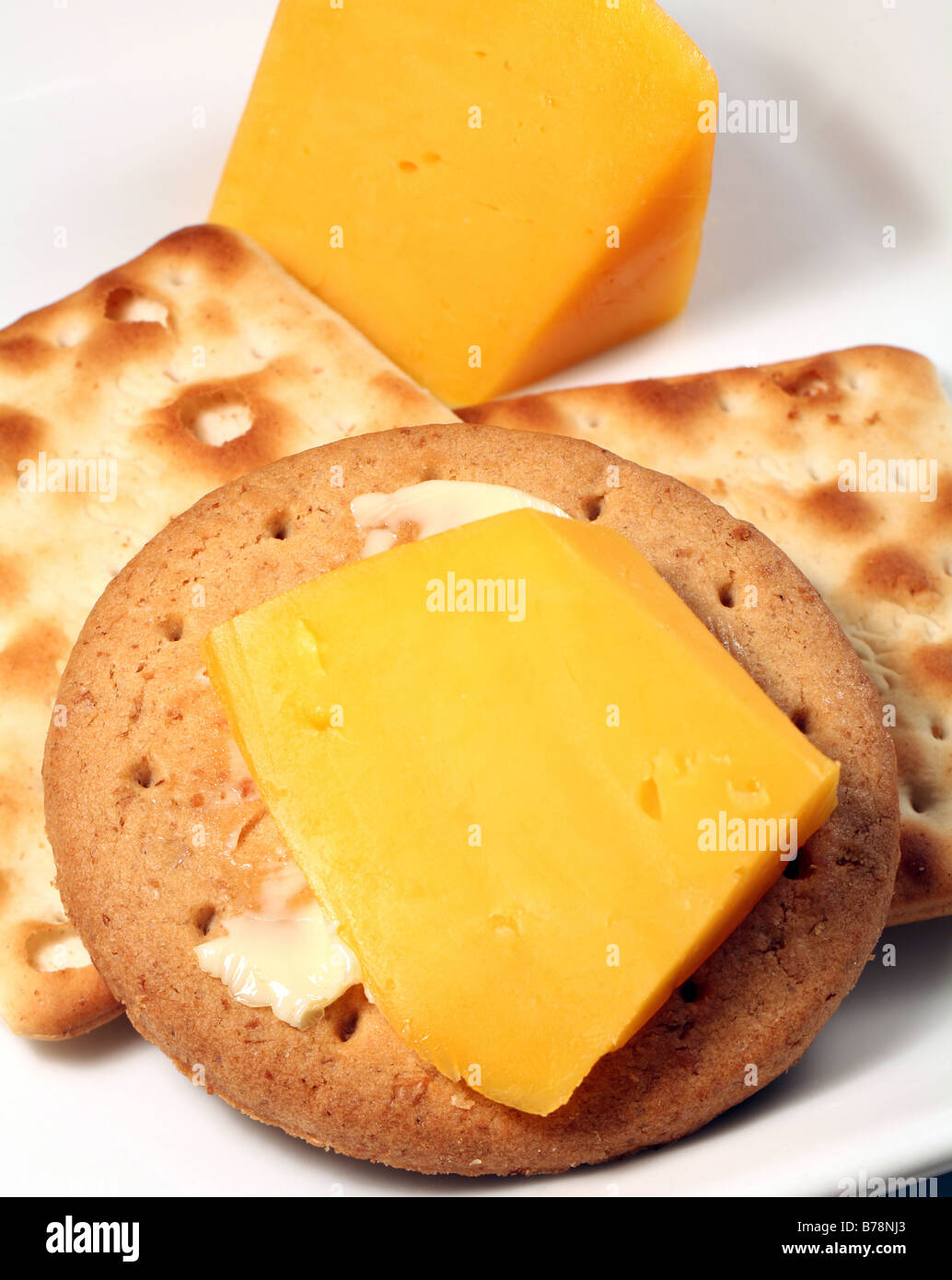A buttered digestive biscuit and cream crackers with cheddar cheese Stock Photo Alamy
