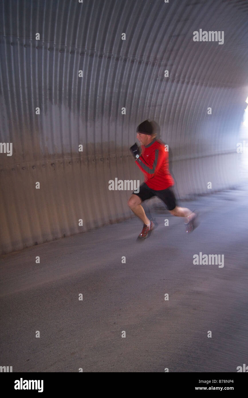 A man running through a tunnel in Reno in Nevada Stock Photo