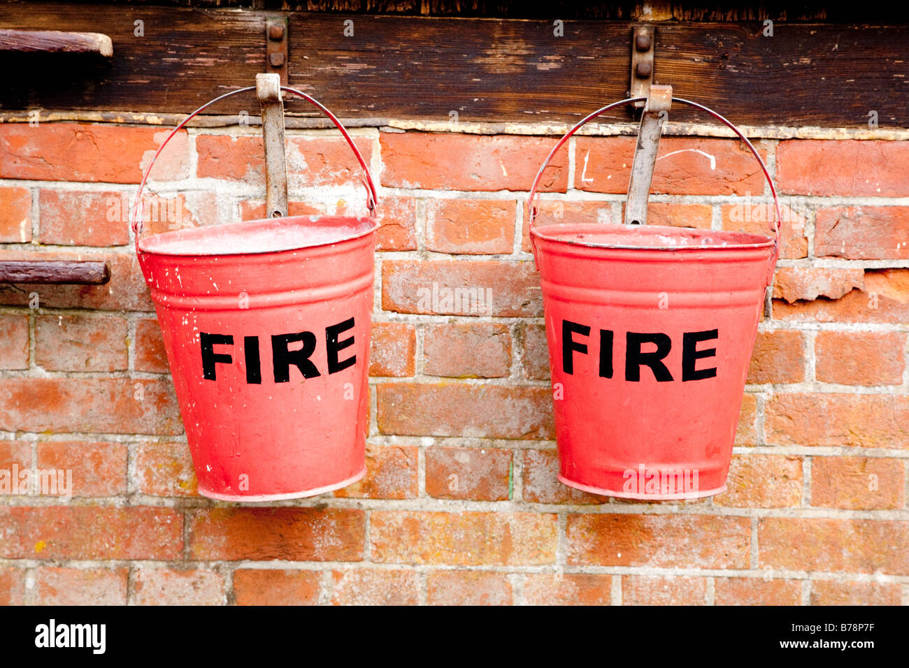 Fire buckets filled with sand Stock Photo Alamy