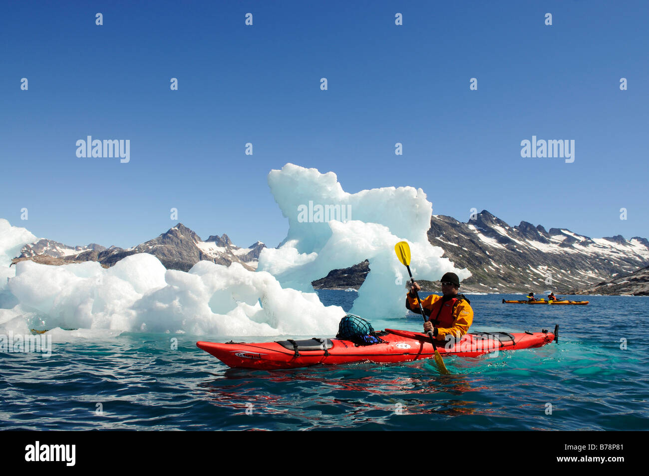 Kayak in front of icebergs, Ikasartivaq Fjord, East Greenland