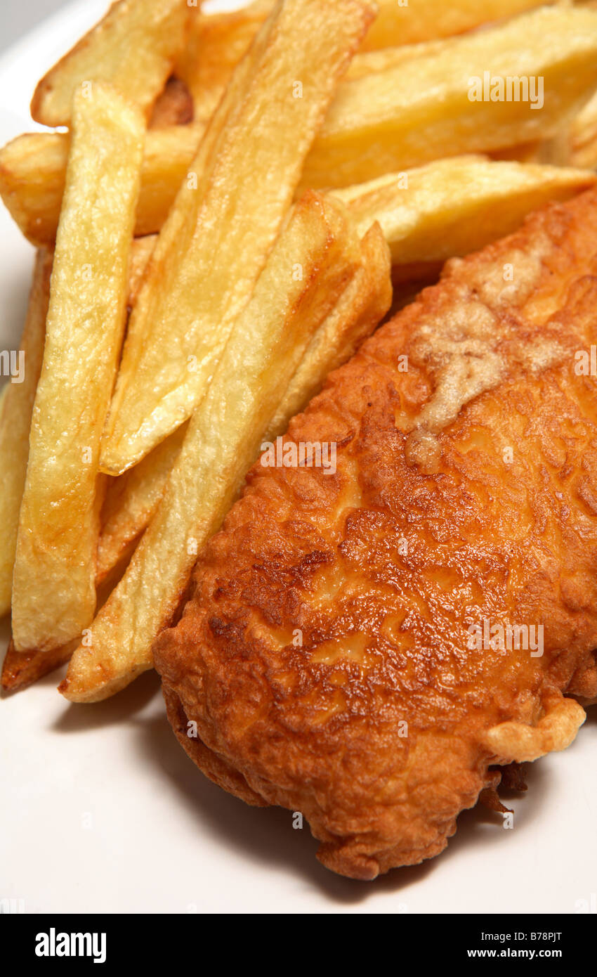 Traditional English home-made fish and chips (french fries) on a plate,close-up Stock Photo