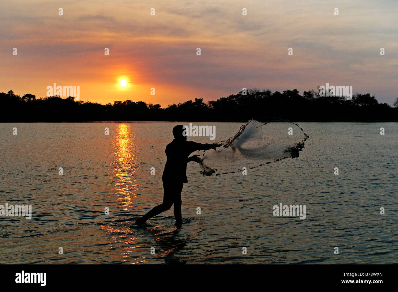 Angler at sunset, Janie Creek, Cape York Peninsula, Queensland, Australia Stock Photo