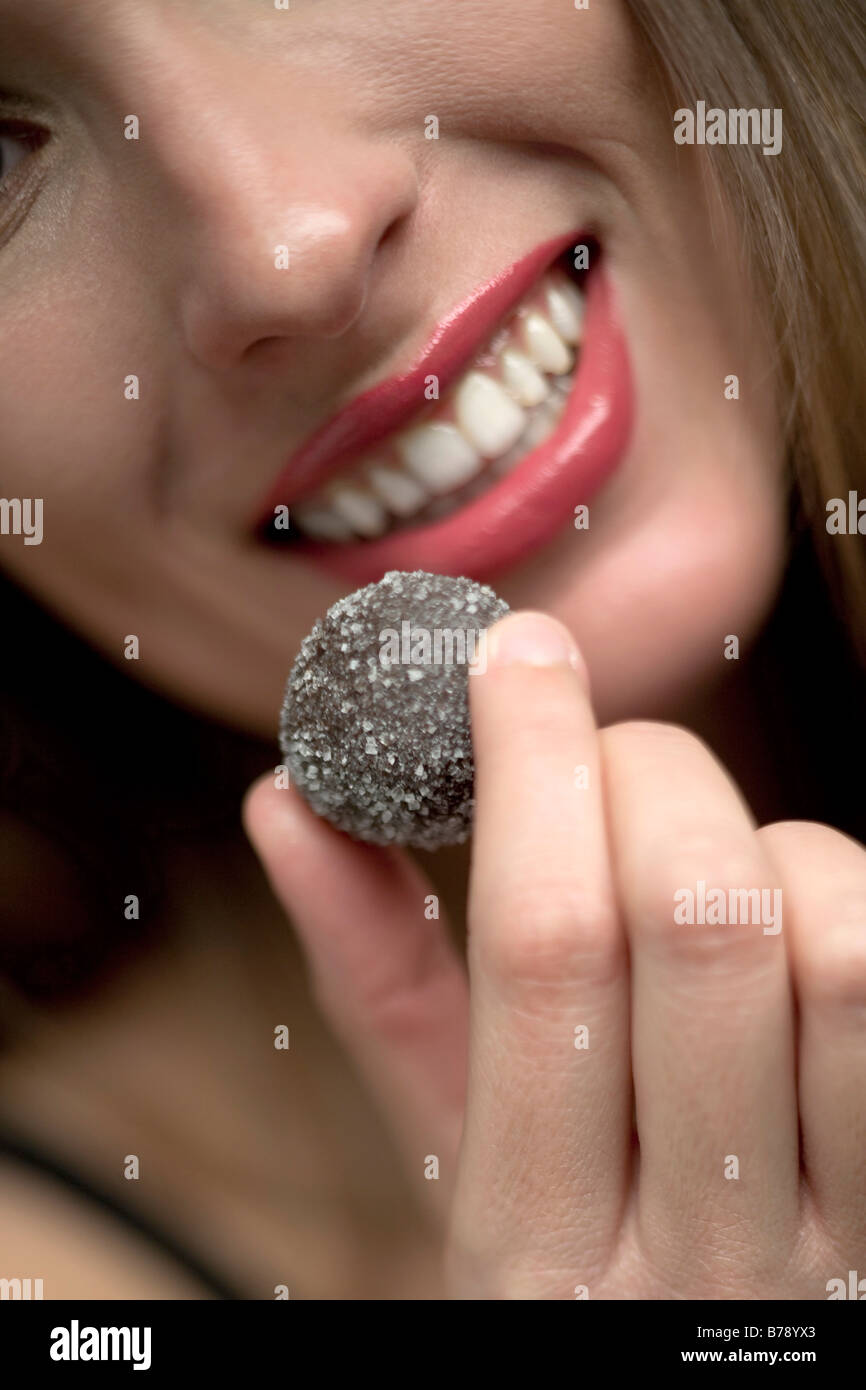 Young woman eating grapes, portrait, close-up Stock Photo - Alamy