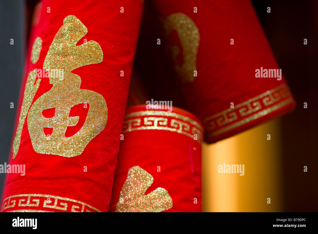 Chinese fire cracker good luck charms hanging during Chinese New Year in Hong Kong Stock Photo