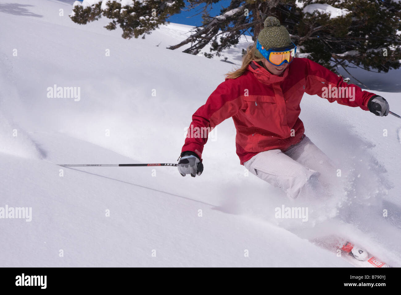 A woman skiing powder snow at Northstar at Tahoe ski area near Lake Tahoe in California Stock Photo