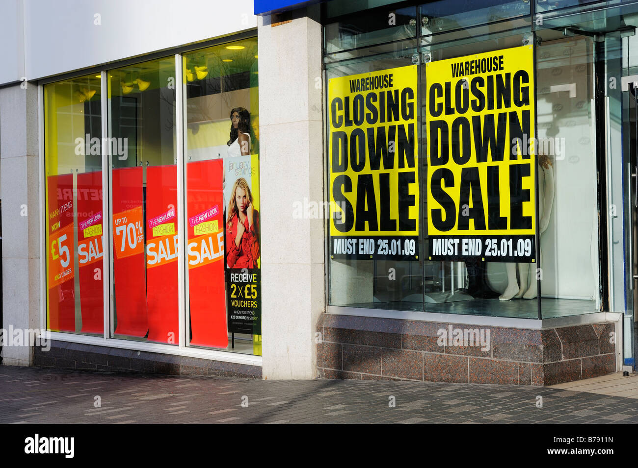 Shop windows in Williamson Square, Liverpool with 'Sale' notices Stock Photo