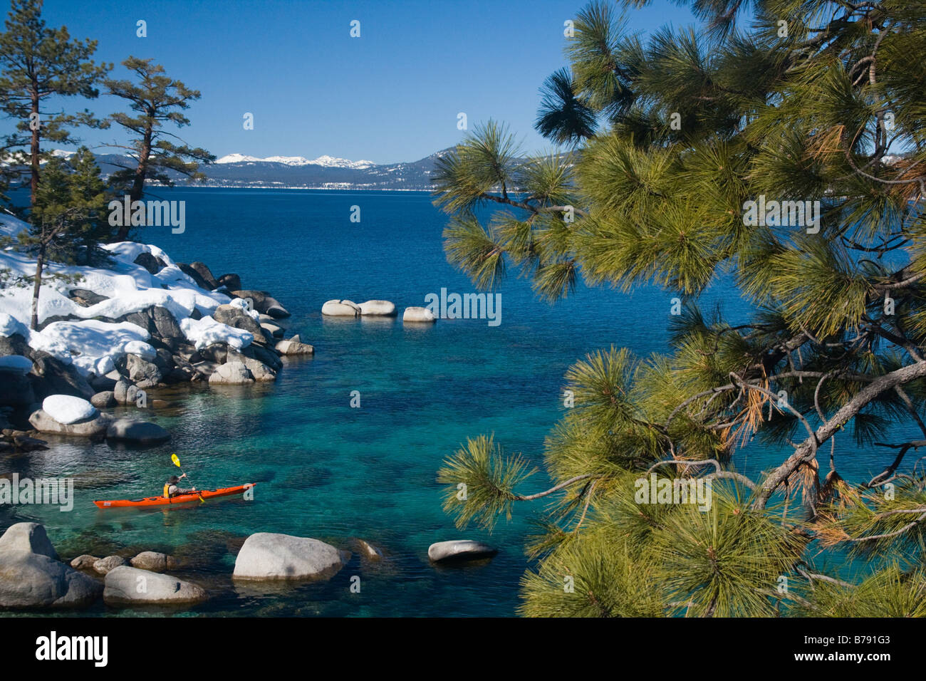 A man sea kayaking on Lake Tahoe near Incline Village in Nevada Stock