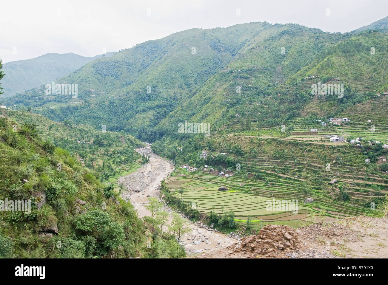 Green mountains and fields along the Karakoram highway in Pakistan Stock Photo