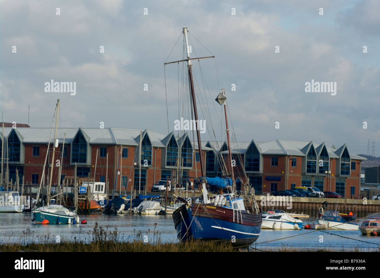 A Yacht Aground On The Mud Flats of THe River Adur Shoreham by SEa West Sussex Stock Photo