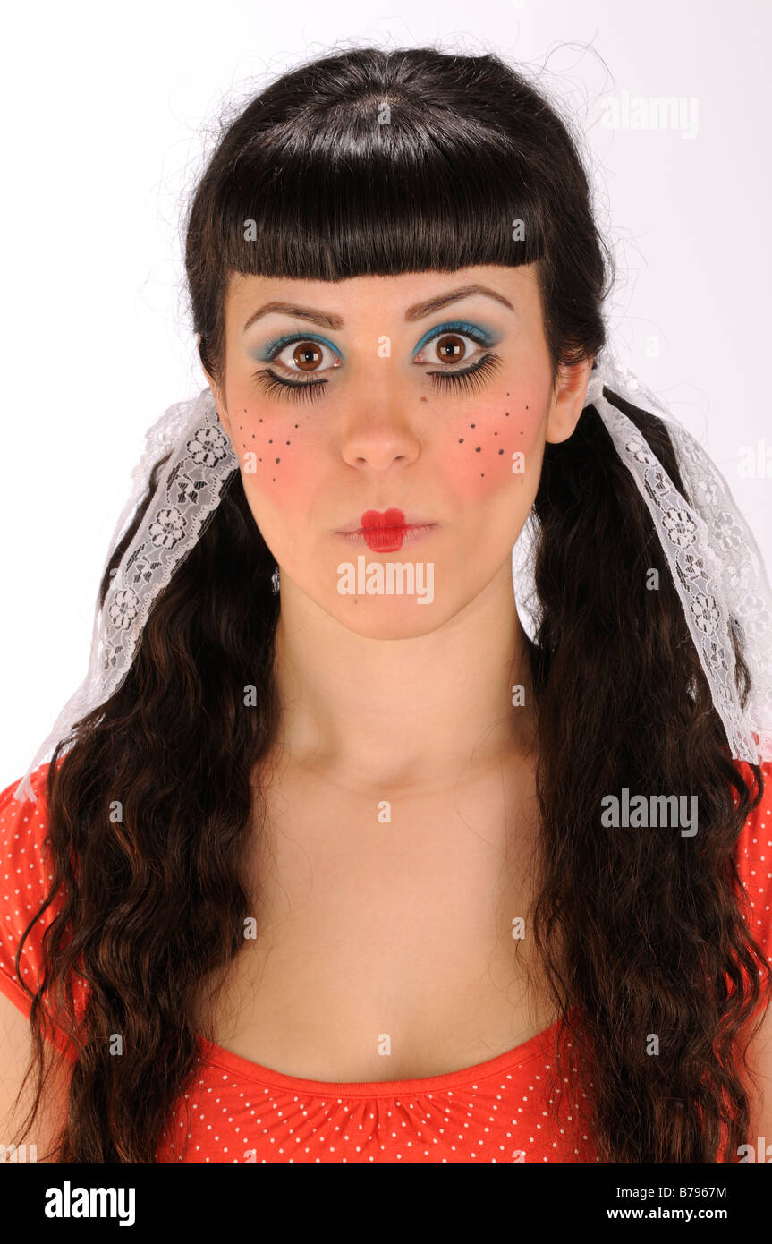 Portrait of woman made up as a fake doll Stock Photo