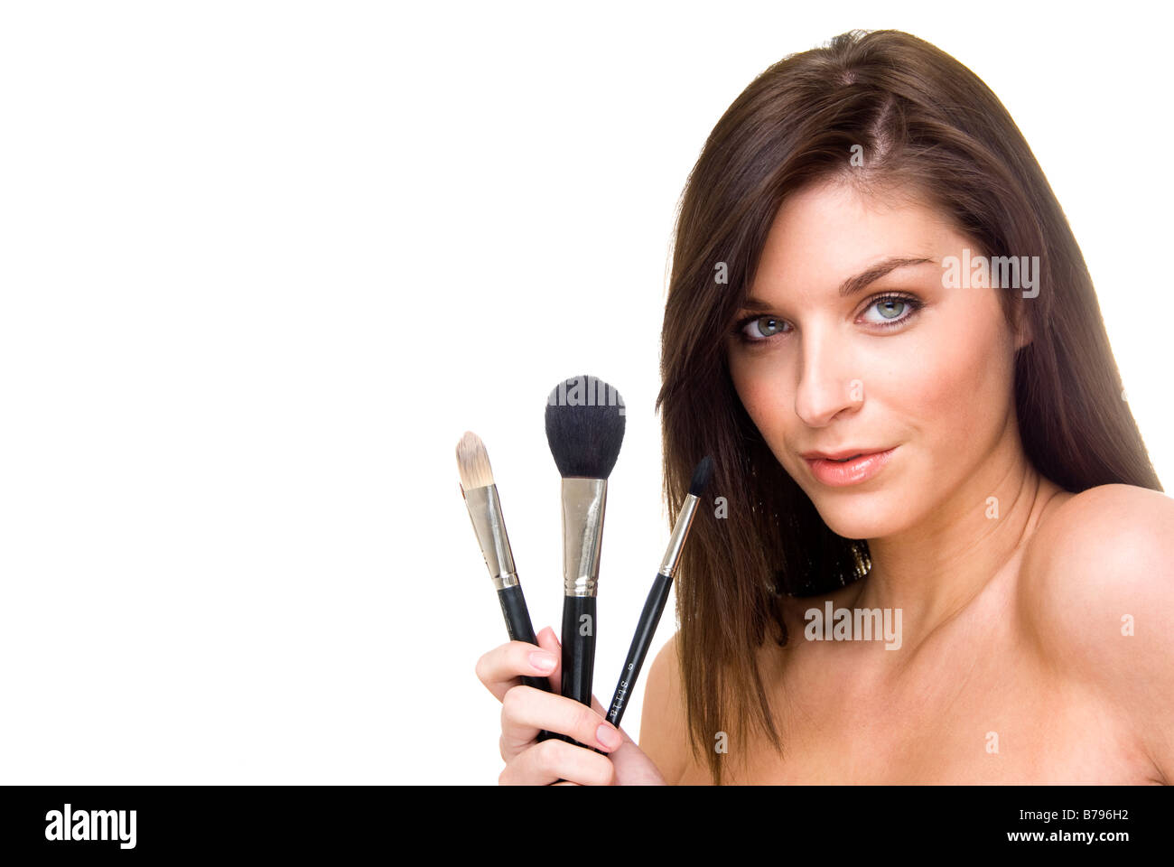 woman holding a set of make up brushes Stock Photo