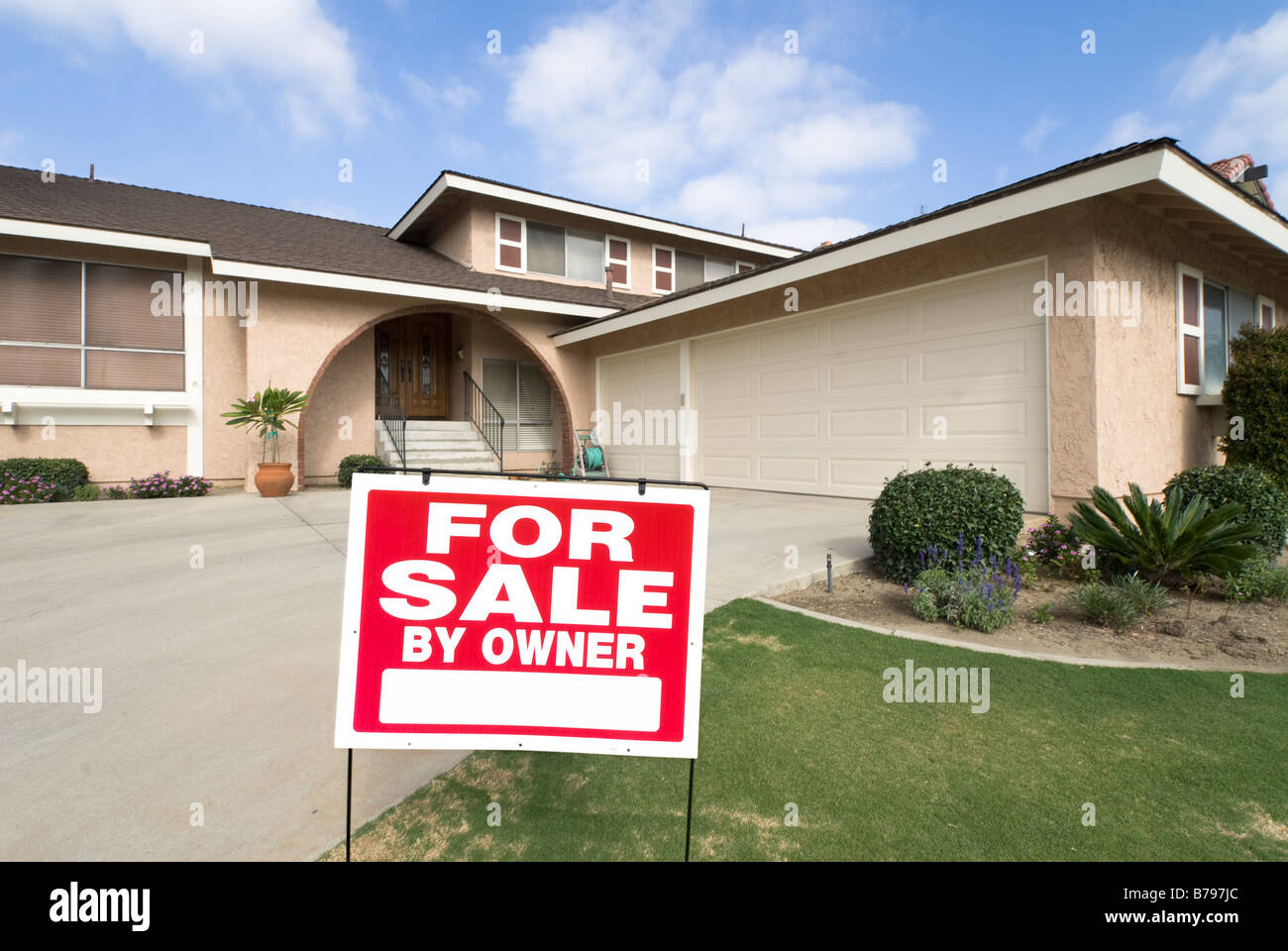 A home is being sold during tough economic times Stock Photo