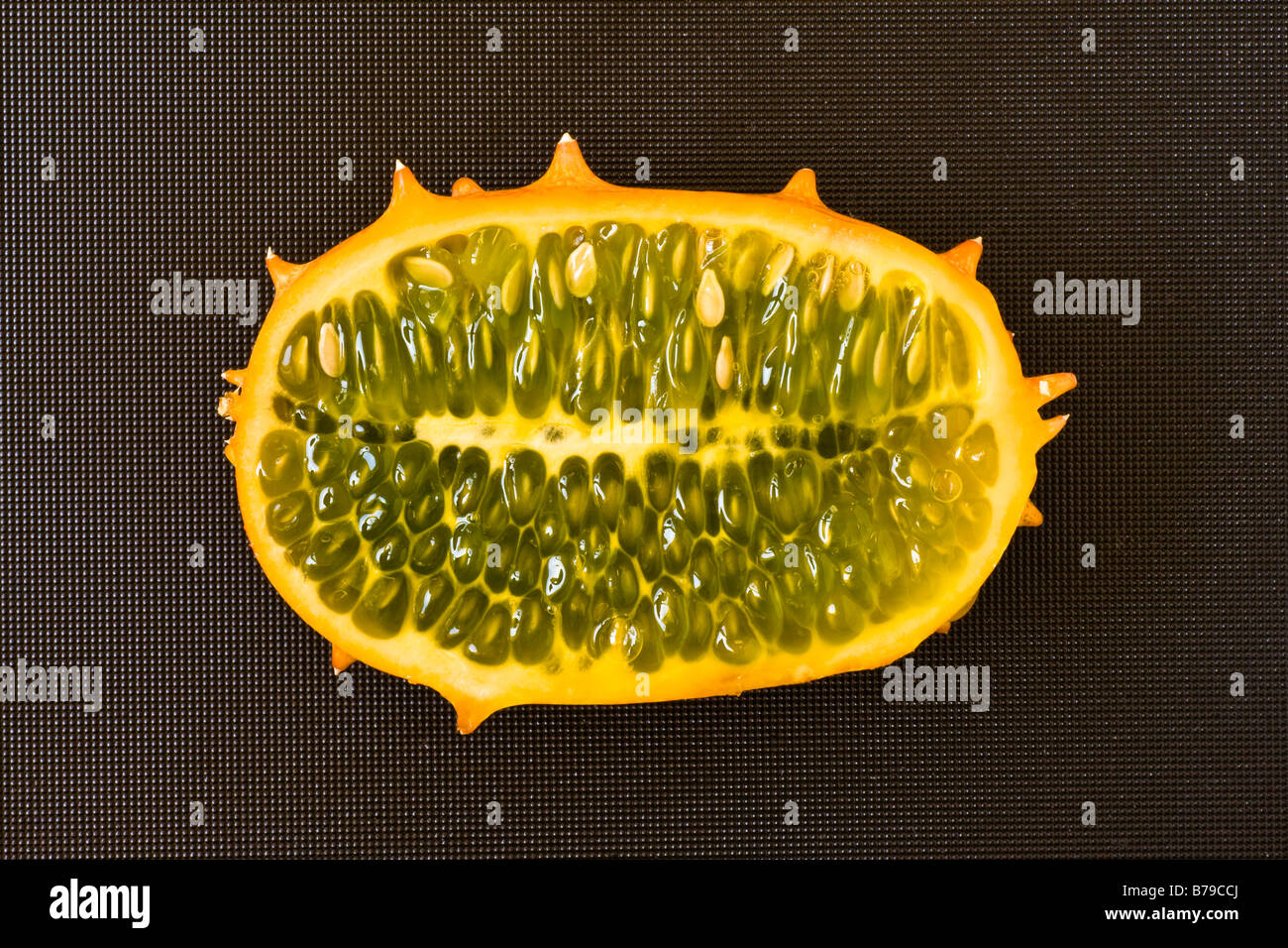 sliced Kiwano fruit on a black cutting board Stock Photo Alamy