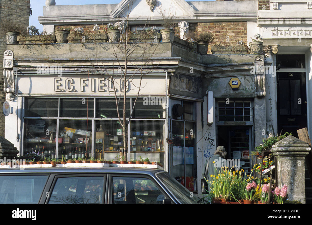 Flowers for sale outside eccentric general store and off licence in Chesterton Road, London W10