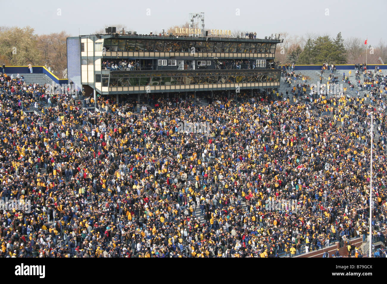 Fans pack the University of Michigan football stadium for a college football game. Stock Photo