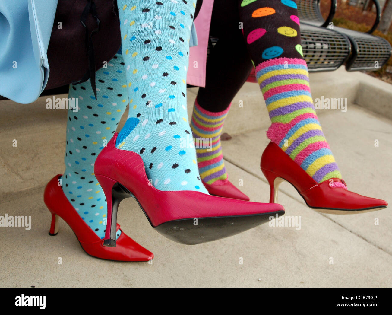 Young women with colorful socks and red shoes Stock Photo Alamy