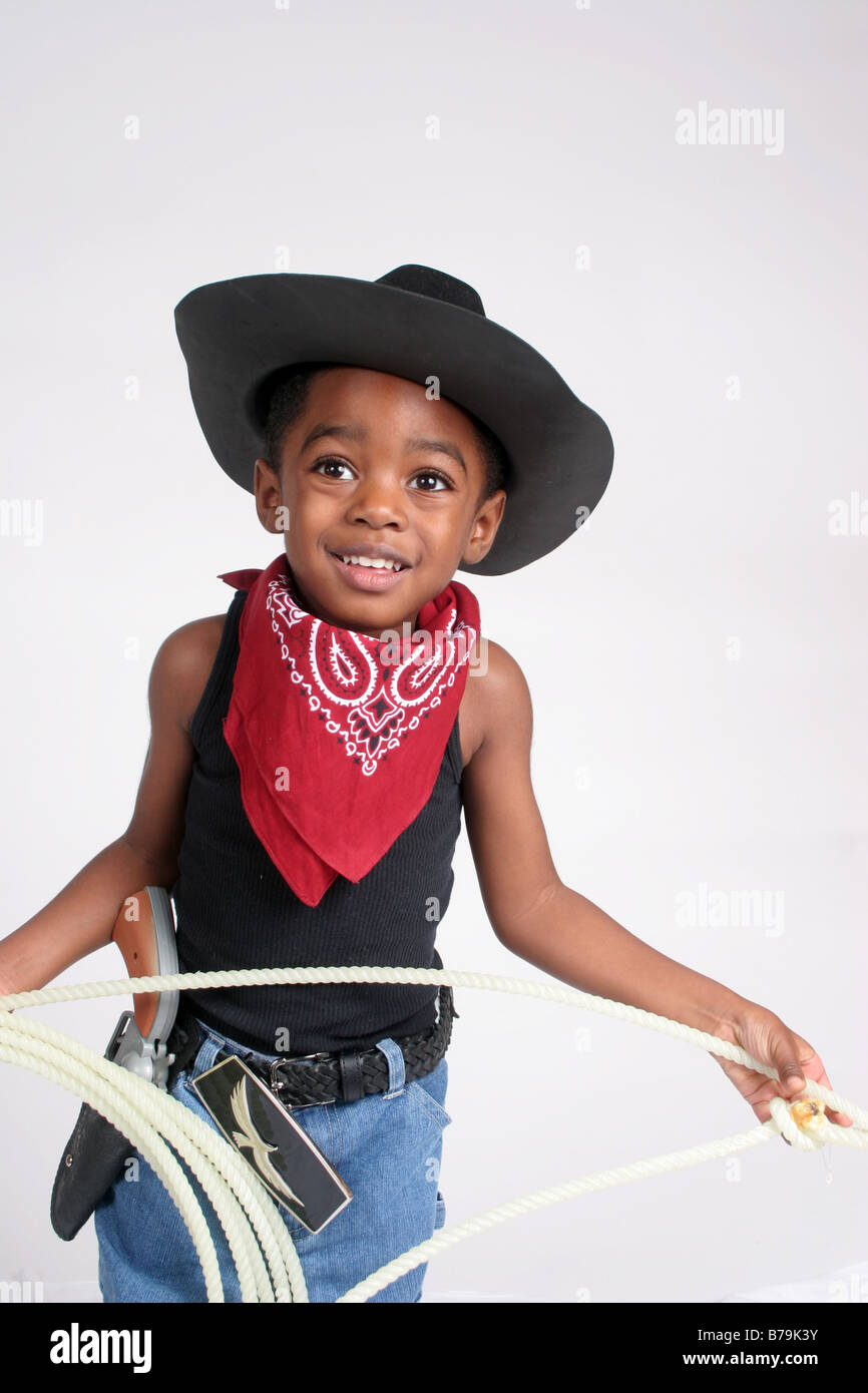African American boy  in  cowboy outfit, with bandanna and rope Stock Photo