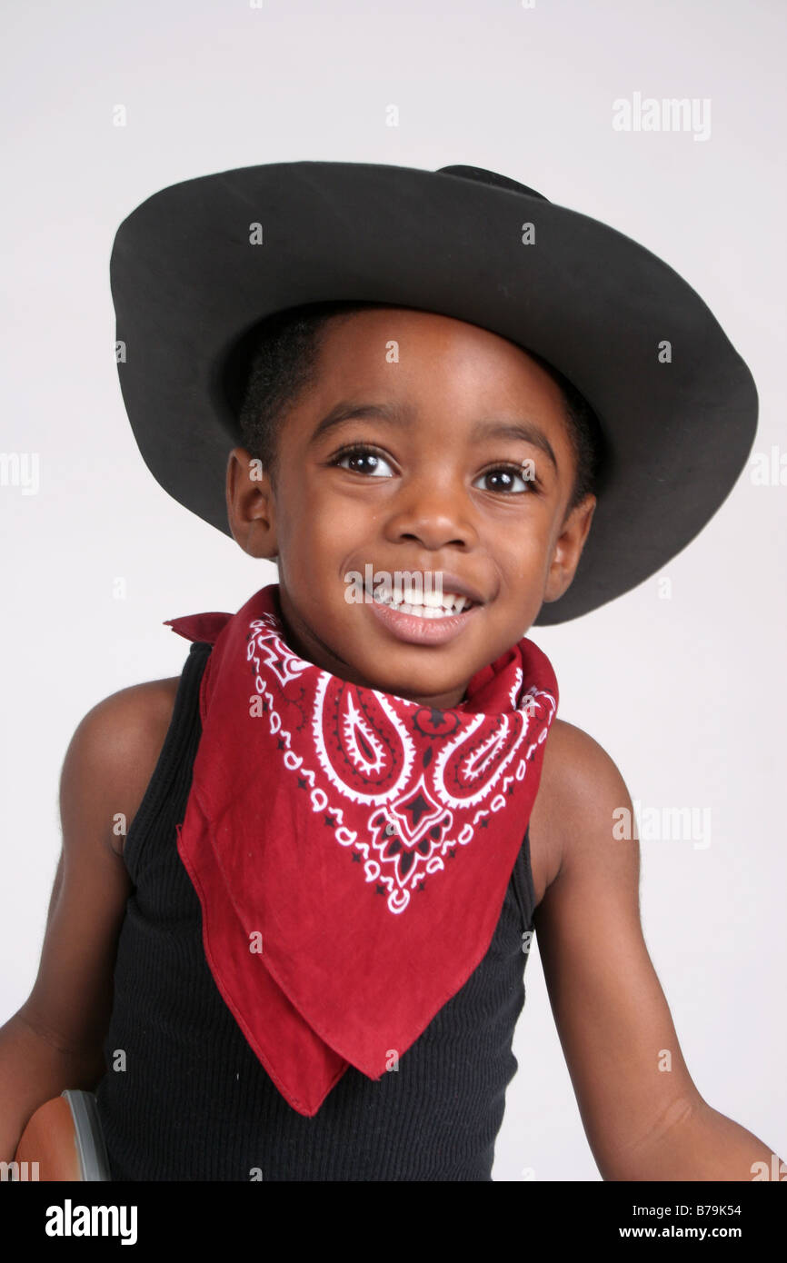 African American boy  in  cowboy outfit, with bandanna and rope Stock Photo