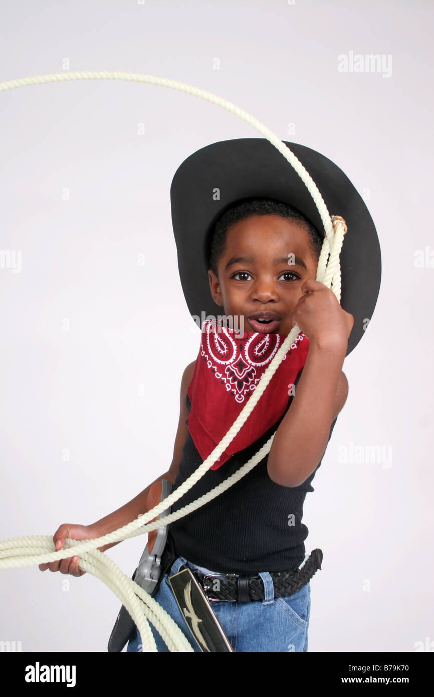 African American boy in cowboy outfit, with bandanna and rope Stock