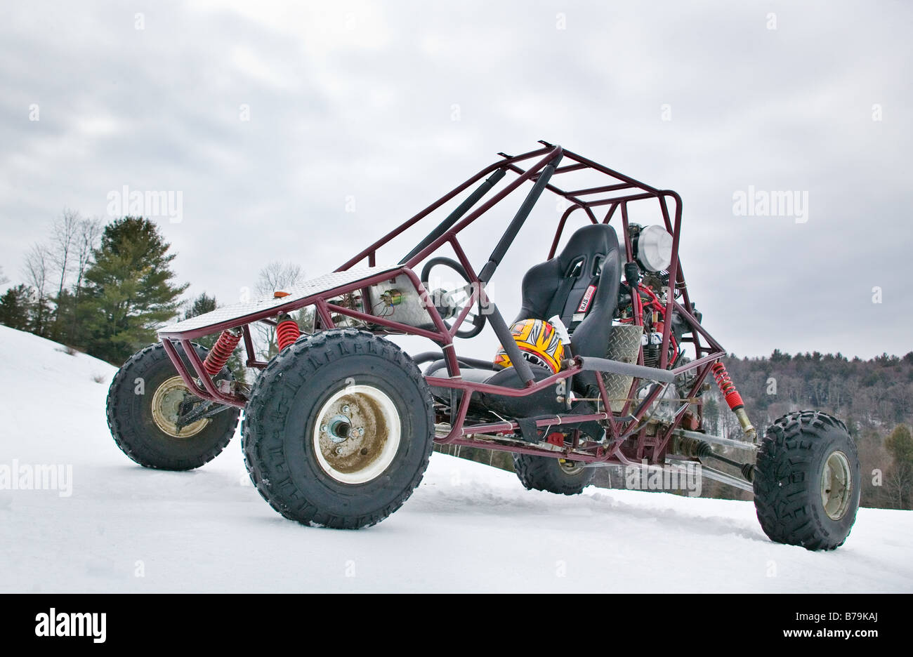 An off road buggy sitting in a snow covered field Stock Photo Alamy