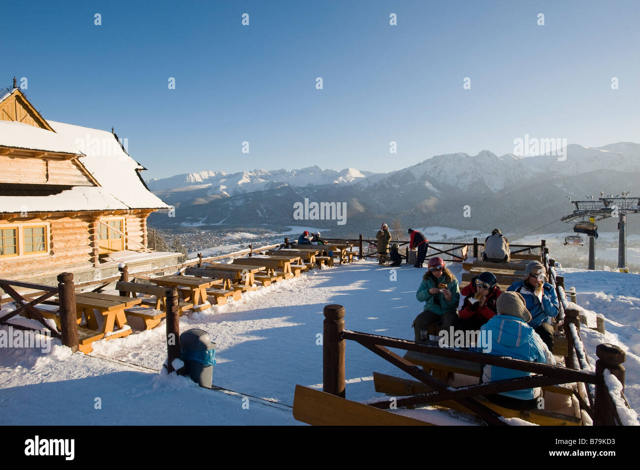 Skiers relax in lokal bar on Gubalowka Hill overlooking Zakopane and Tatra Mountains Podhale Region Poland Stock Photo