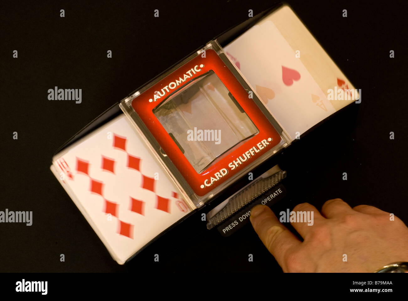 Electronic / automatic playing card shuffler in use Stock Photo Alamy