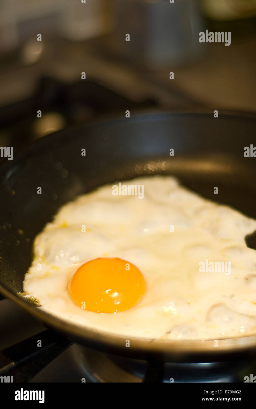 Frying an egg Stock Photo Alamy