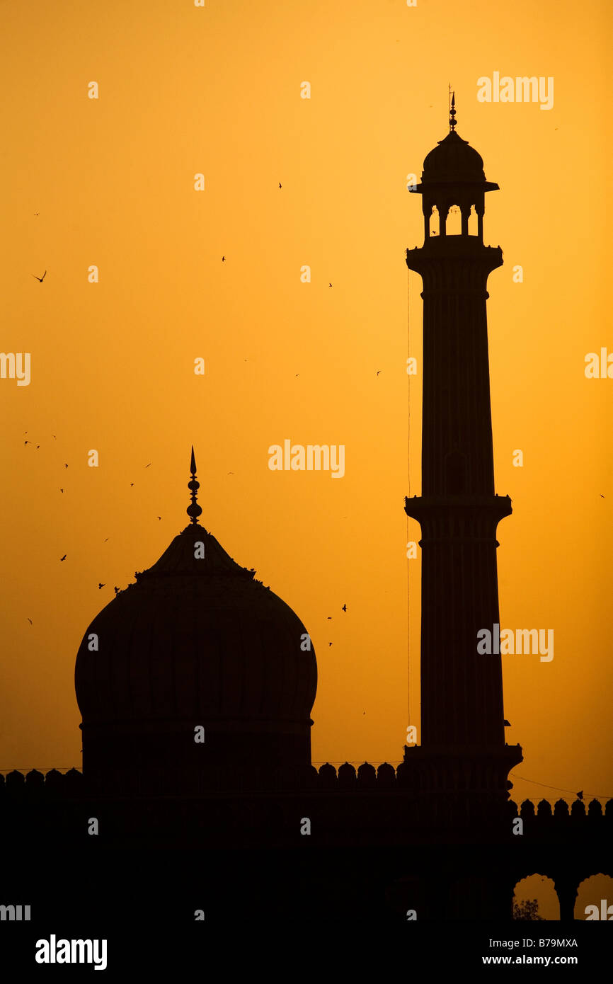 Sunset over the Jama Masjid in Delhi, India. The Jama Masjid is the largest mosque in India and was built by Shahjahan. Stock Photo