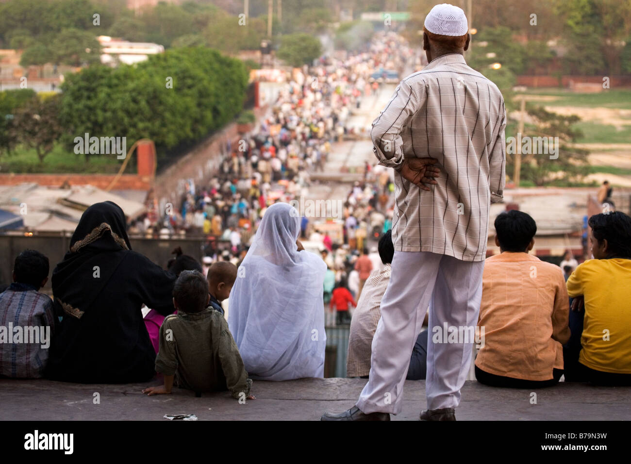 A muslim family together on the steps of the Jama Masjid in Delhi, India. Stock Photo