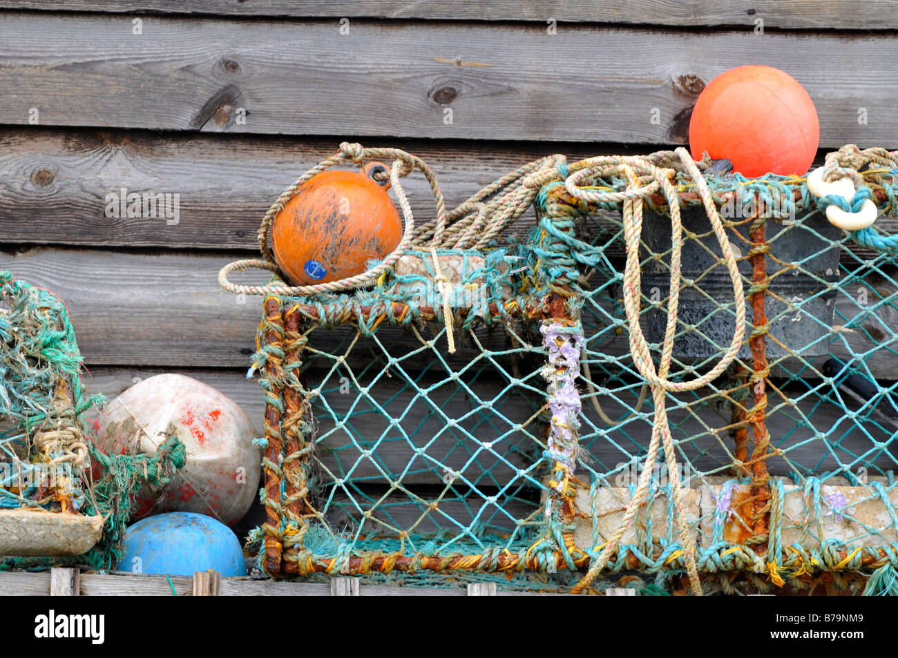 some old lobster pots floats buoys and fishing nets with ropes