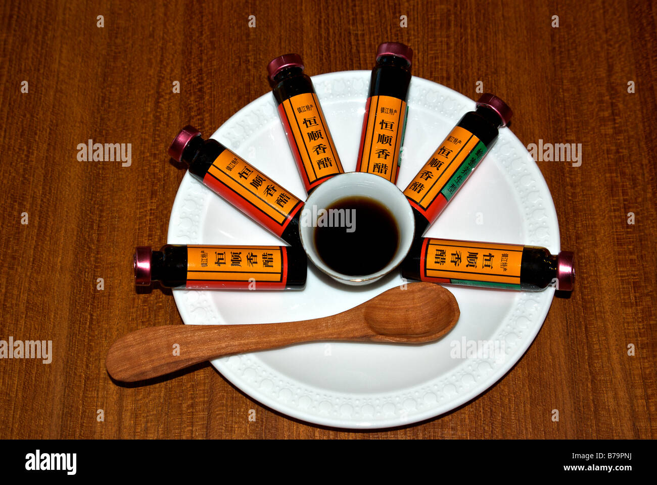 Sample bottles of famous fragrant Zhenjiang vinegar and some in a small