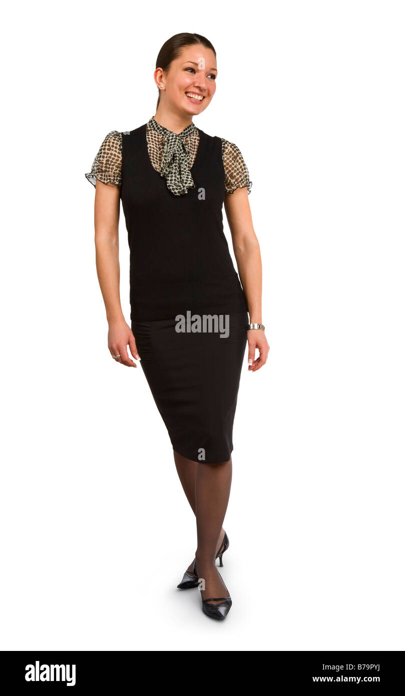 Happy and well dressed business woman standing and looking away Stock Photo