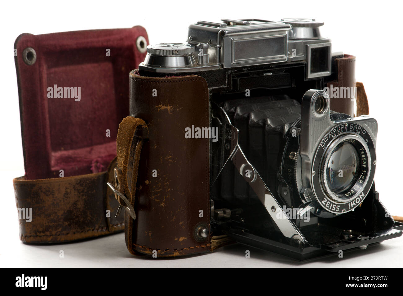 Old fold out Zeiss Camera partially inside its original leather case. Stock Photo