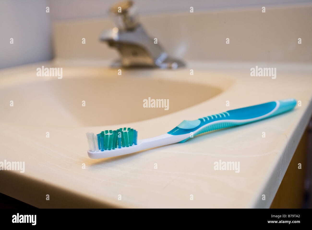 A toothbrush sits on a sink Stock Photo - Alamy