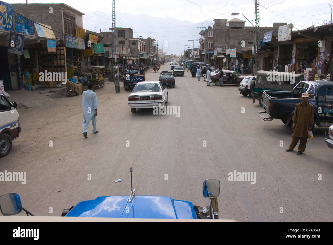 The main street,pedestrians and car traffic in the town of Skardu in Baltistan in Pakistan Stock Photo