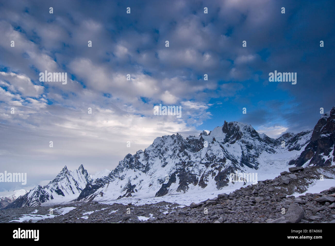Granite mountain spires with snow on the Biafo glacier in the Karakoram himalaya mountains of Pakistan Stock Photo