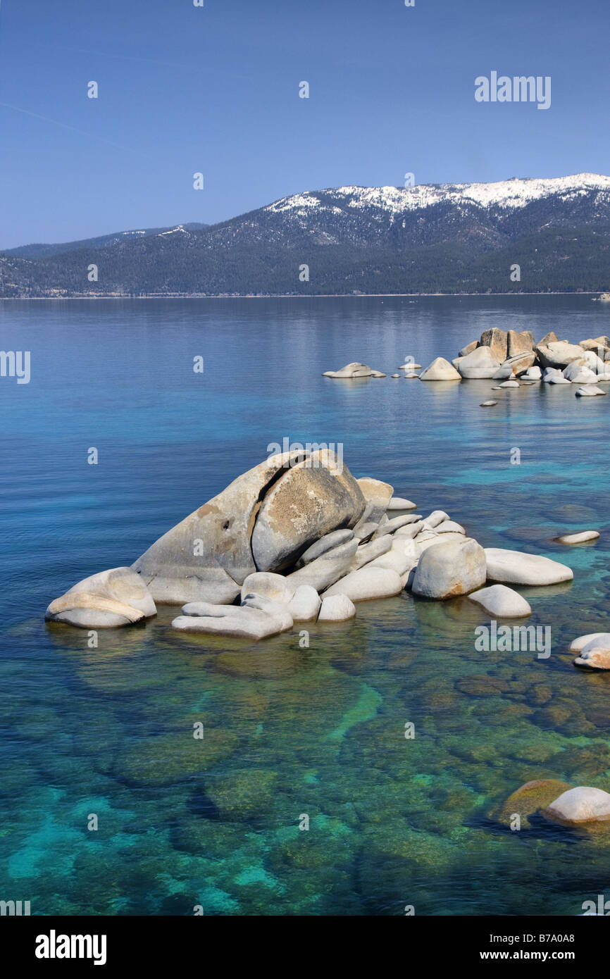 HDR tonemapped Whale rock and snowy mountains on the east shore of Lake Tahoe in the spring Stock Photo