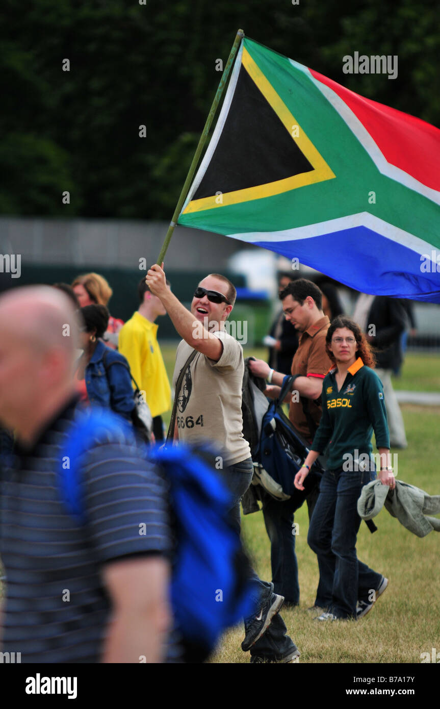 A man proudly waving the flag of South Africa Stock Photo