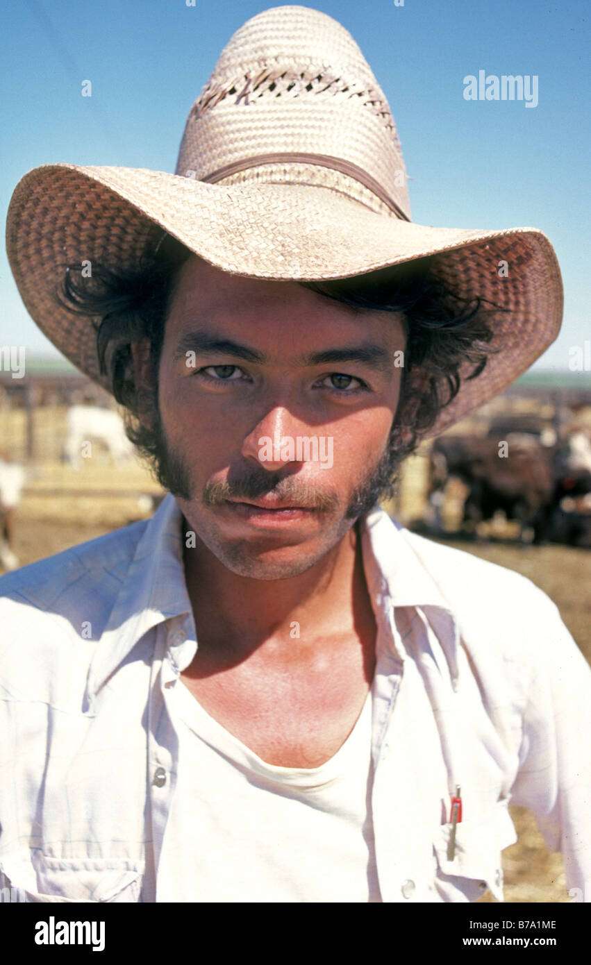 Portrait of illegal Mexican alien immigrant working at a cattle feedlot near El Paso Texas Stock Photo