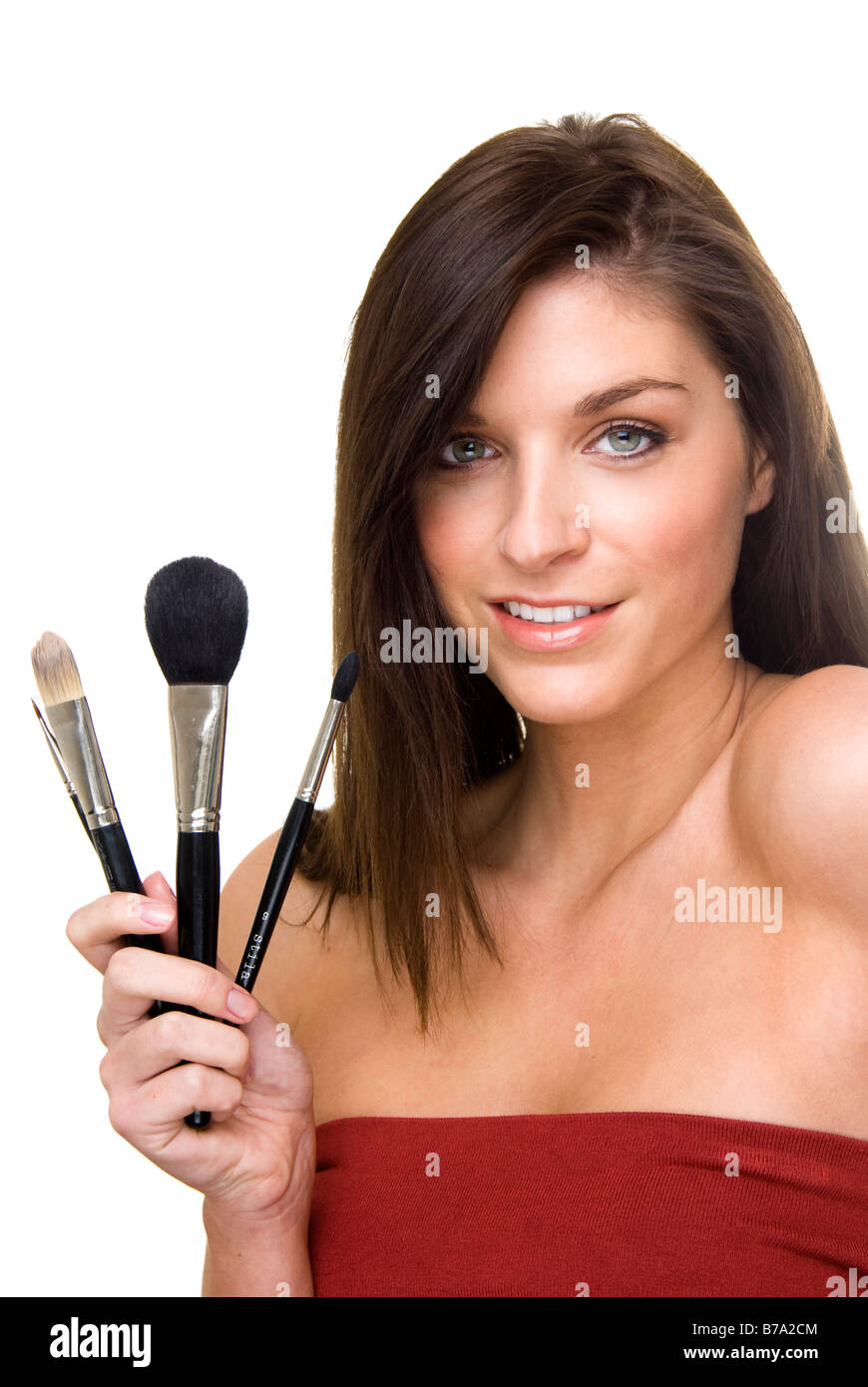 woman holding a set of make up brushes Stock Photo