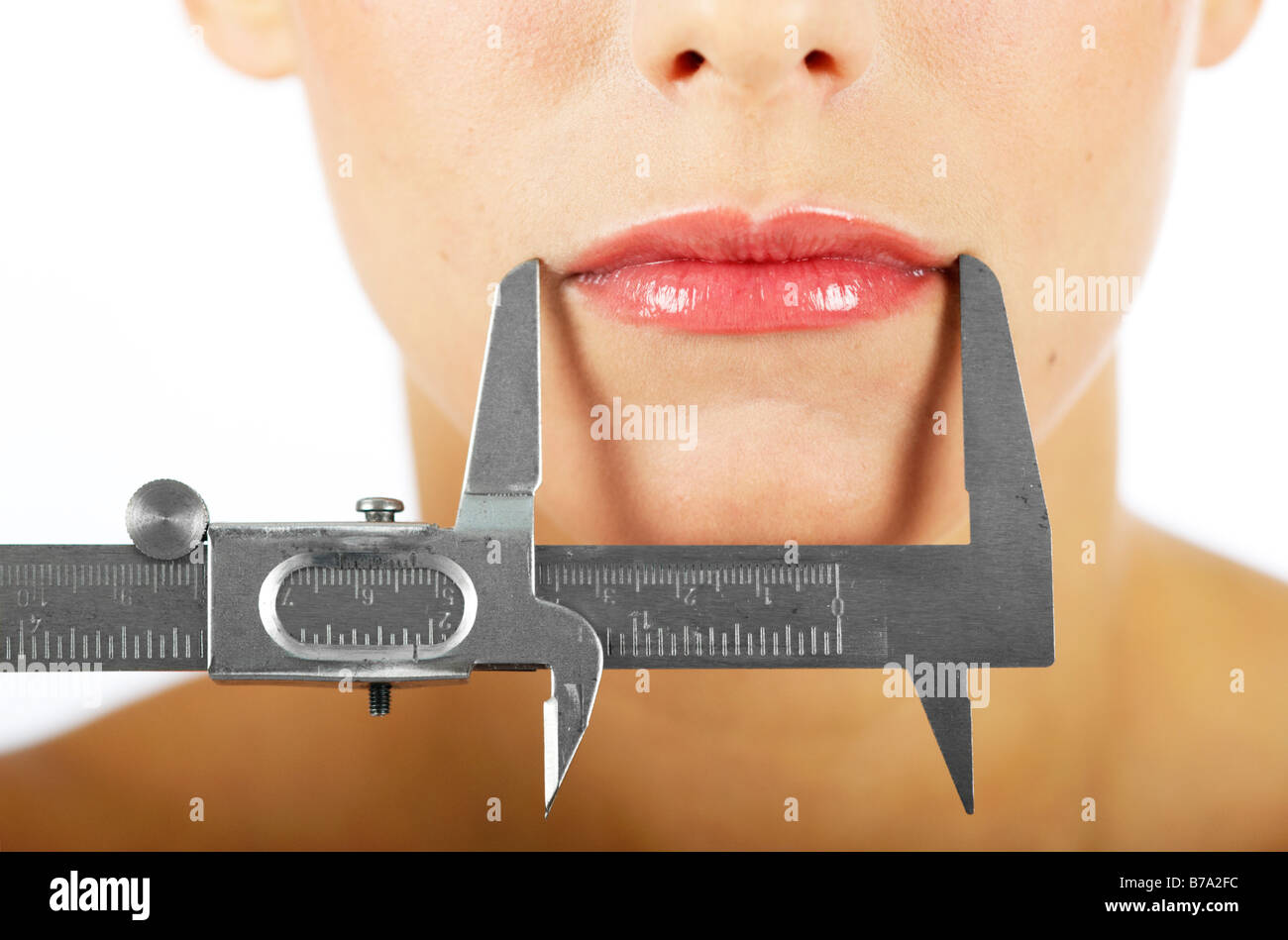 Woman's mouth being measured with a caliper rule Stock Photo Alamy