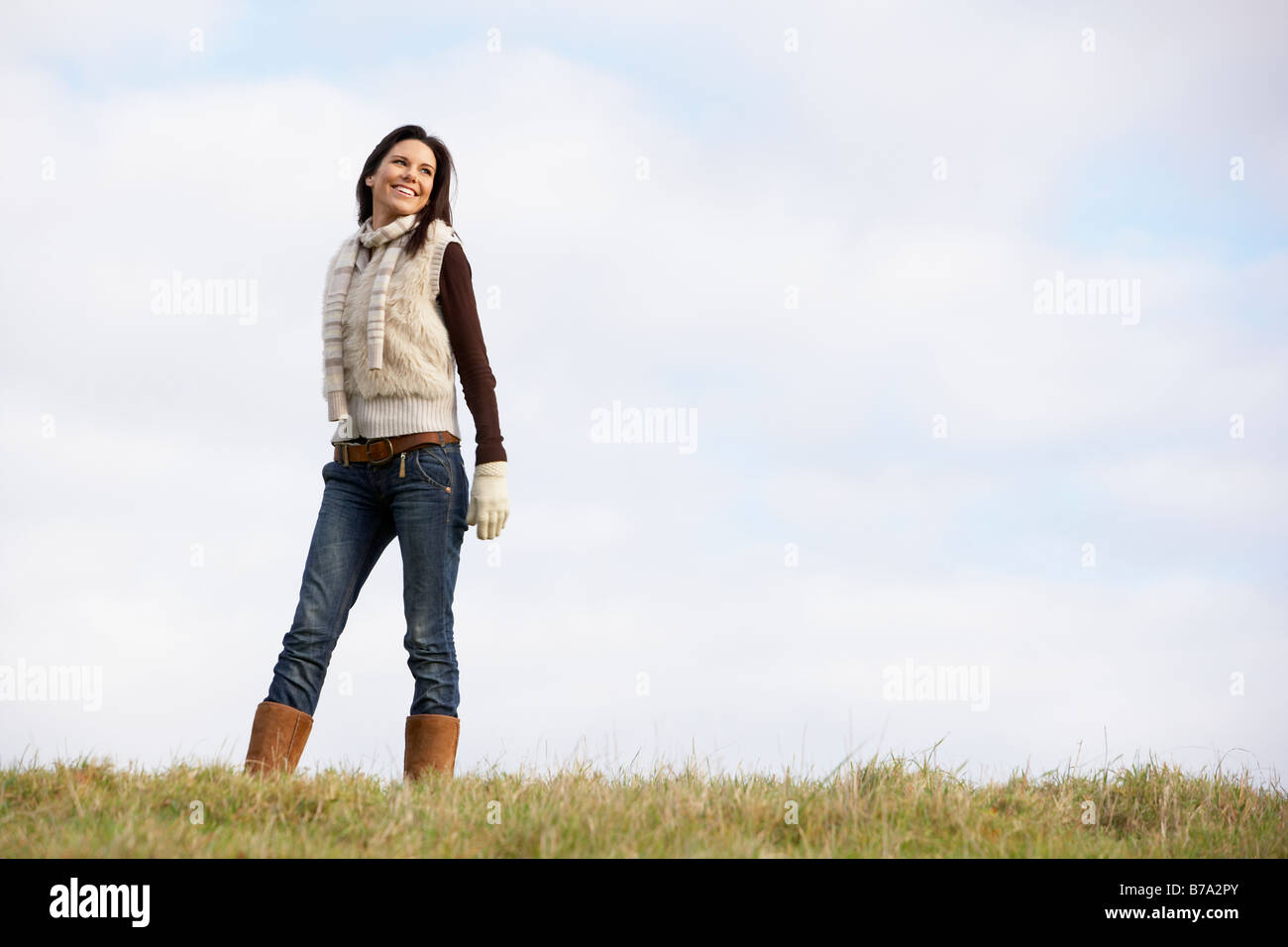 Young Woman Standing In Park Stock Photo - Alamy