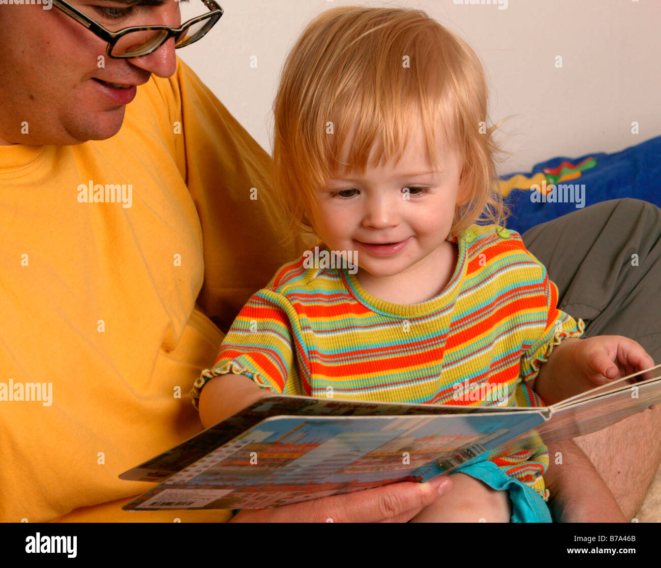 Father reading to his child Stock Photo