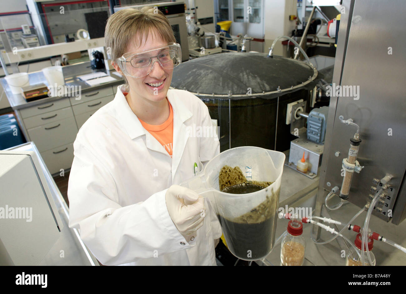 Biotechnologist working in the technical laboratory on a batch fermenter for a biogas plant of the Schmack Biogas AG in Schwand Stock Photo