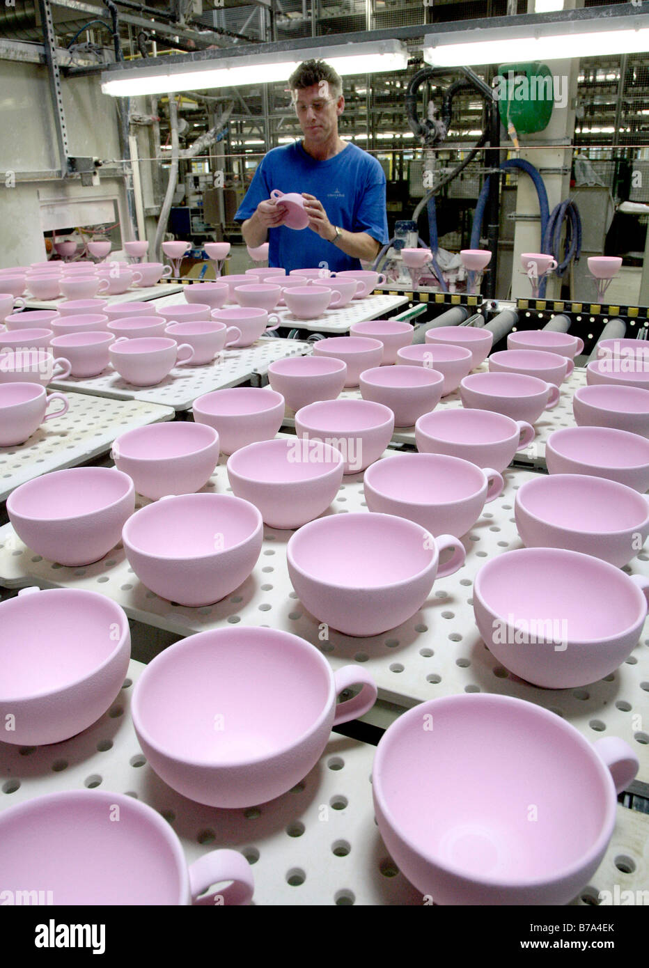 Employee checking cups in the warehouse of the crockery production, Villeroy & Boch AG Faiencerie, Merzig, Saarland, Germany, E Stock Photo