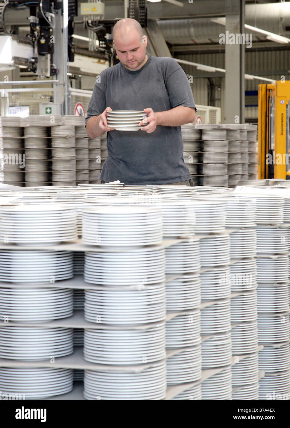 Employee checking plates in the warehouse of the crockery production, Villeroy & Boch AG Faiencerie, Merzig, Saarland, Germany, Stock Photo