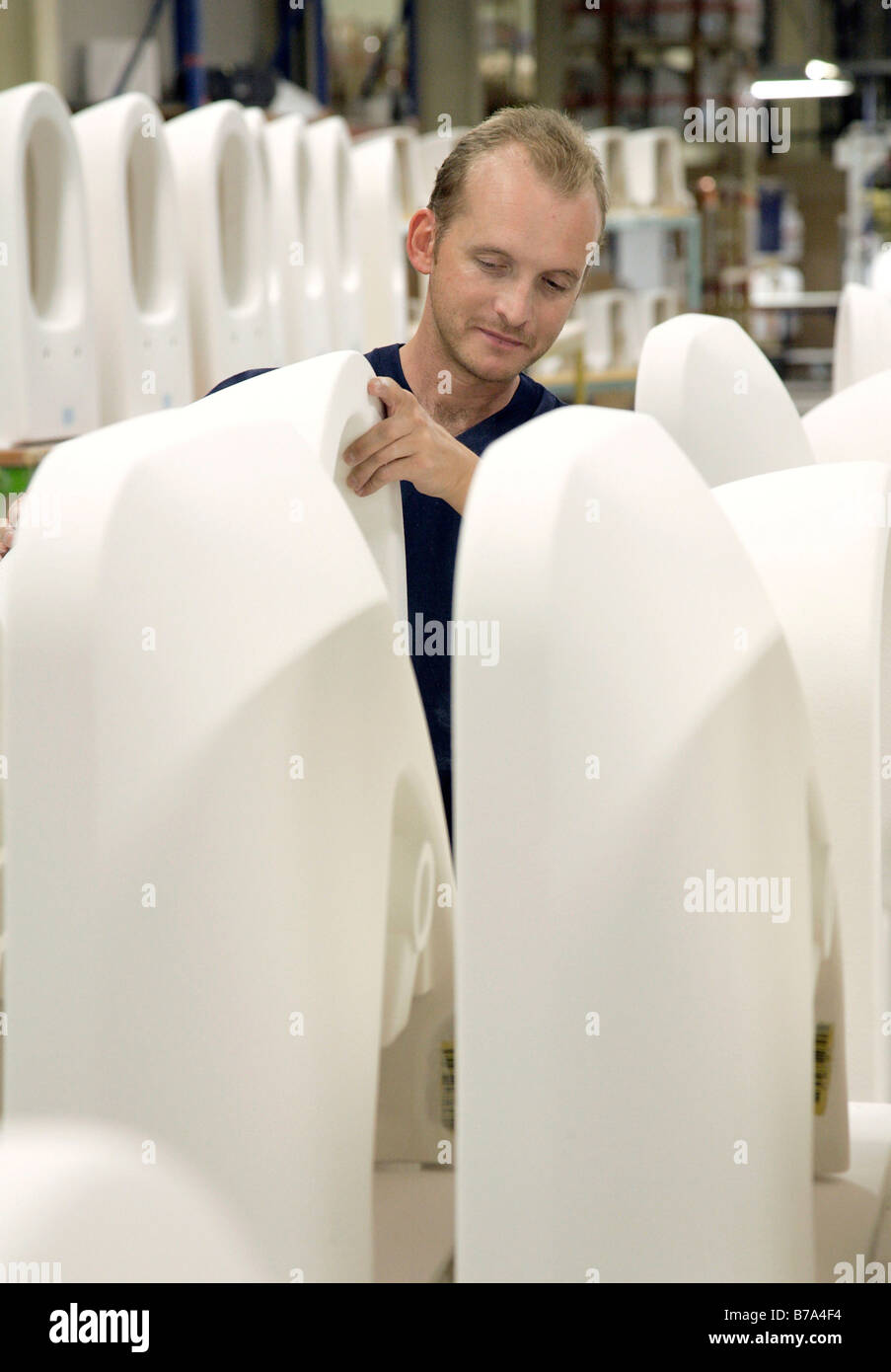 Employee checking toilets in the warehouse, sanitary production of the sanitary factory of the Villeroy & Boch AG in Mettlach,  Stock Photo