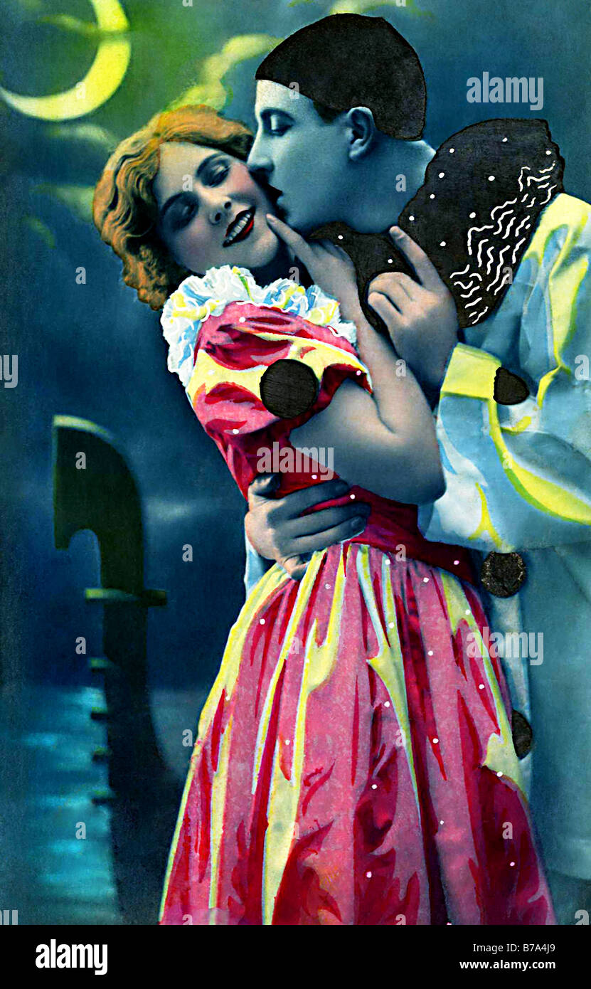 Tender embrace at night and kissing, pierrot and columbine in Venice ...